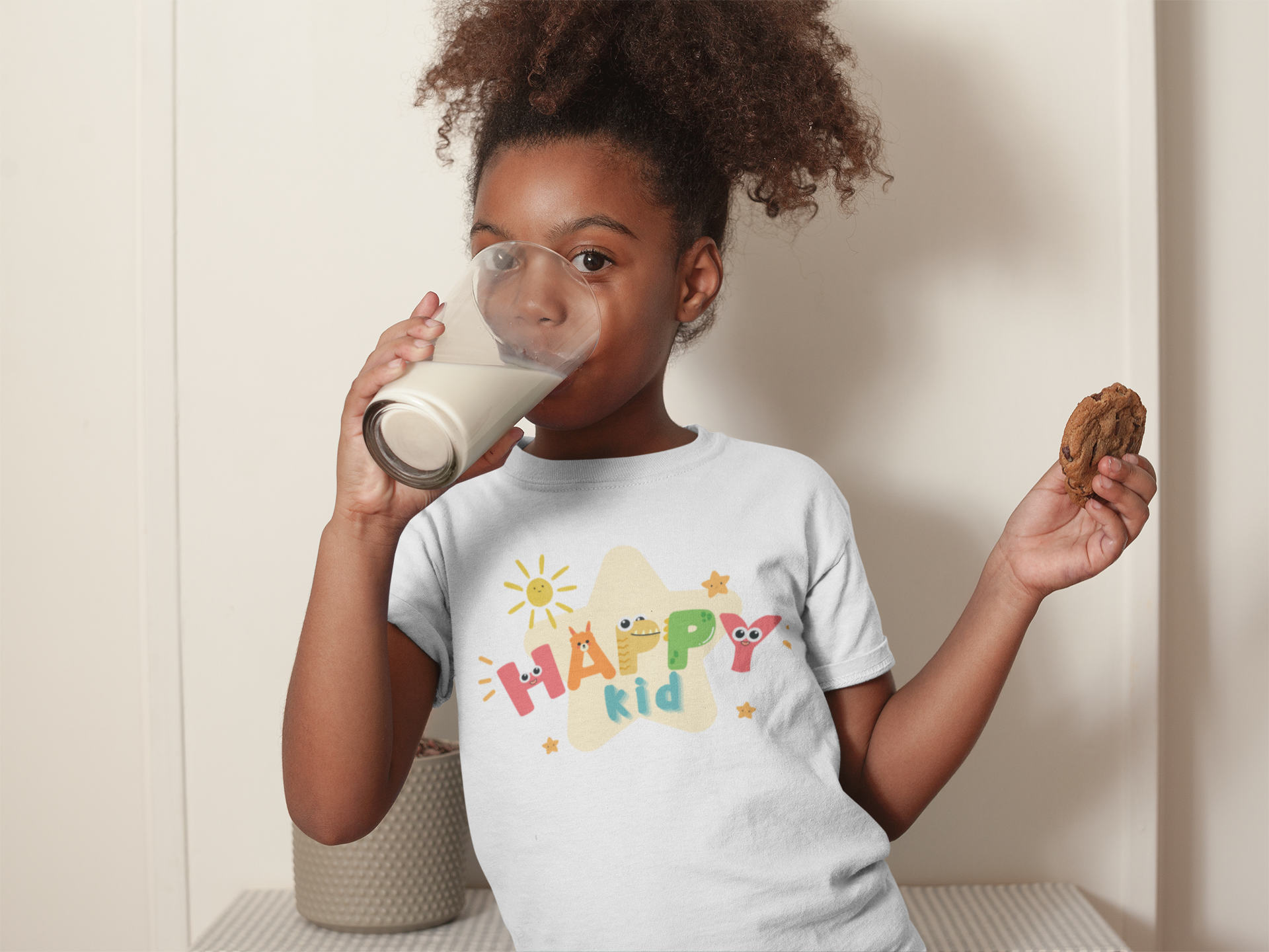 mockup-of-a-black-girl-with-curly-hair-drinking-milk-holding-a-cookie-a21326